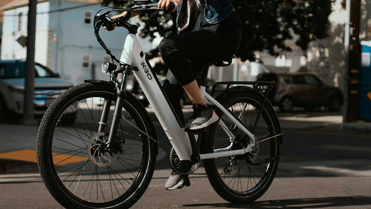 Cyclist riding an electric bike outdoors