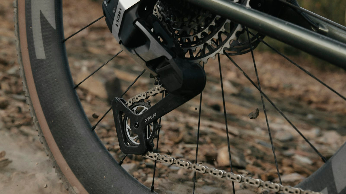 Close-up of a bike tire on a dirt road